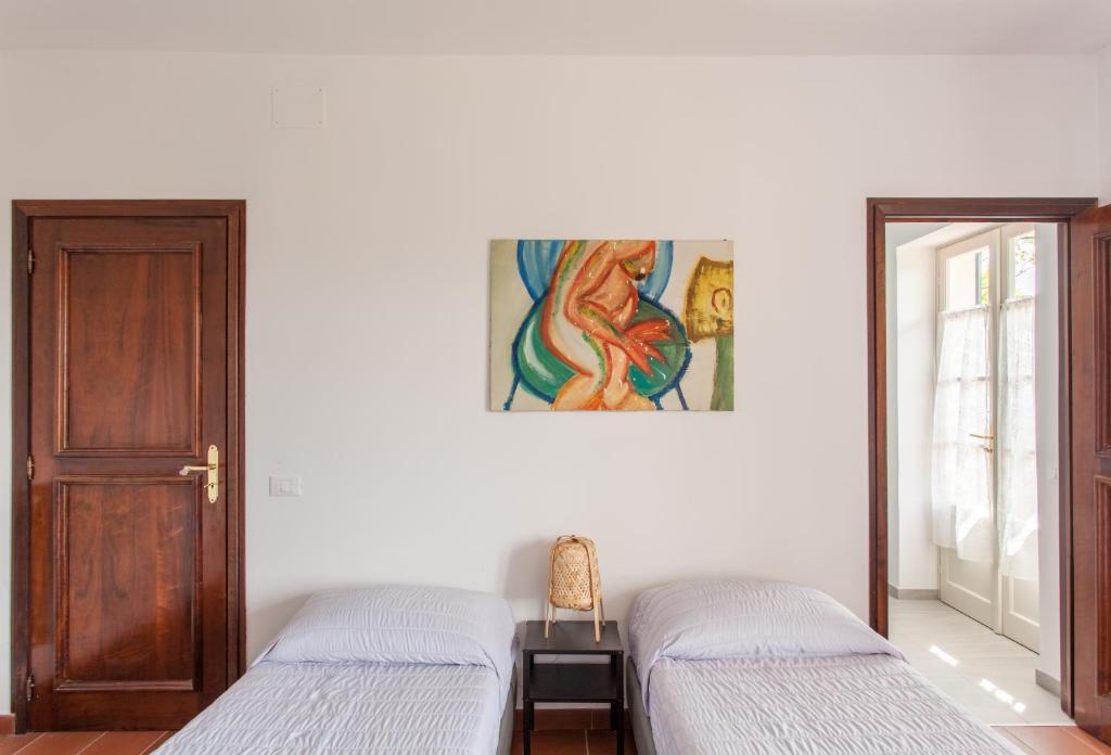 Łóżko lub łóżka w pokoju w obiekcie AMERICA NEI BOSCHI B&B
