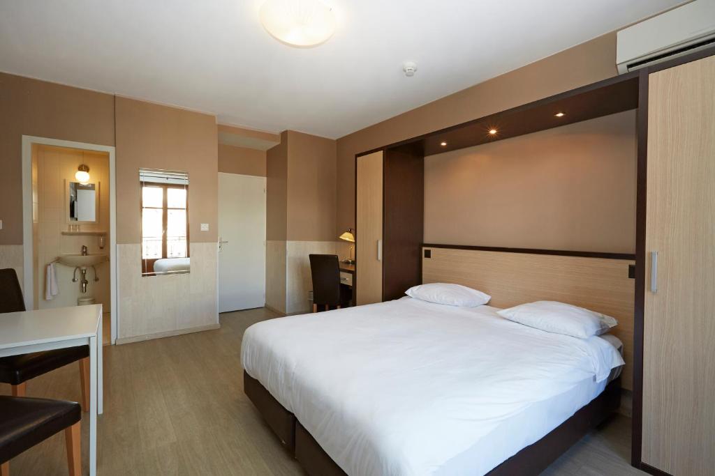 Cama o camas de una habitación en Hotel Central