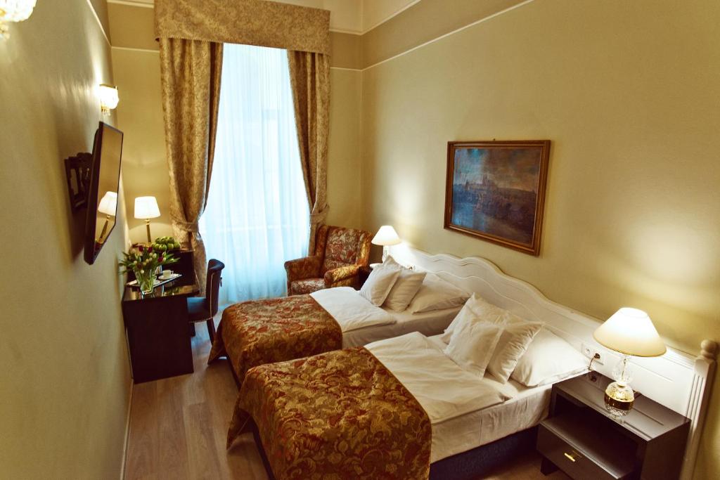 Postel nebo postele na pokoji v ubytování Hotel Julian