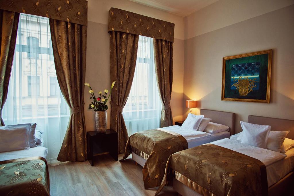 Postel nebo postele na pokoji v ubytování Hotel Julian