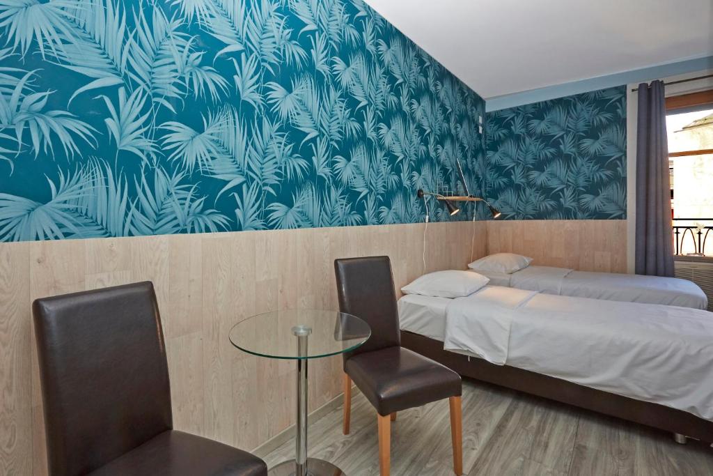 Cama o camas de una habitación en Hotel Central