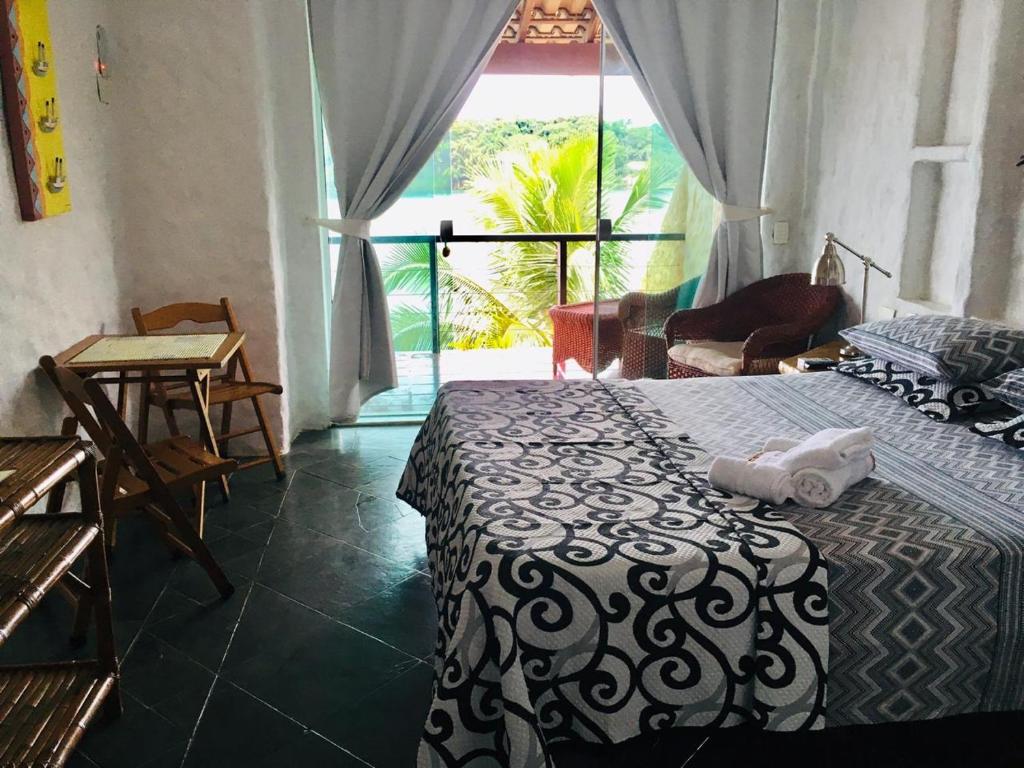 Cama ou camas em um quarto em Pousada Casa Atlântica