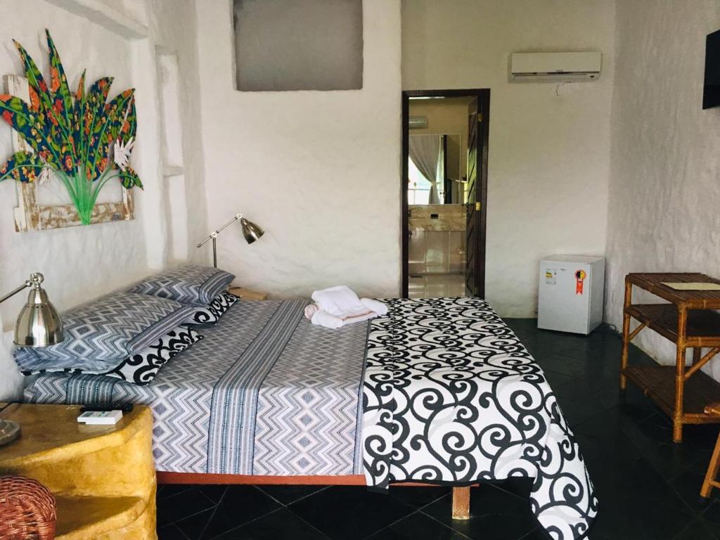 Cama ou camas em um quarto em Pousada Casa Atlântica