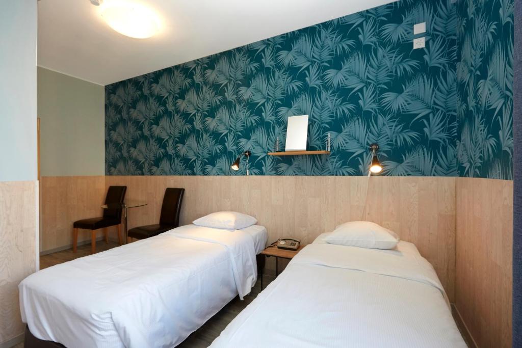 Cama o camas de una habitación en Hotel Central
