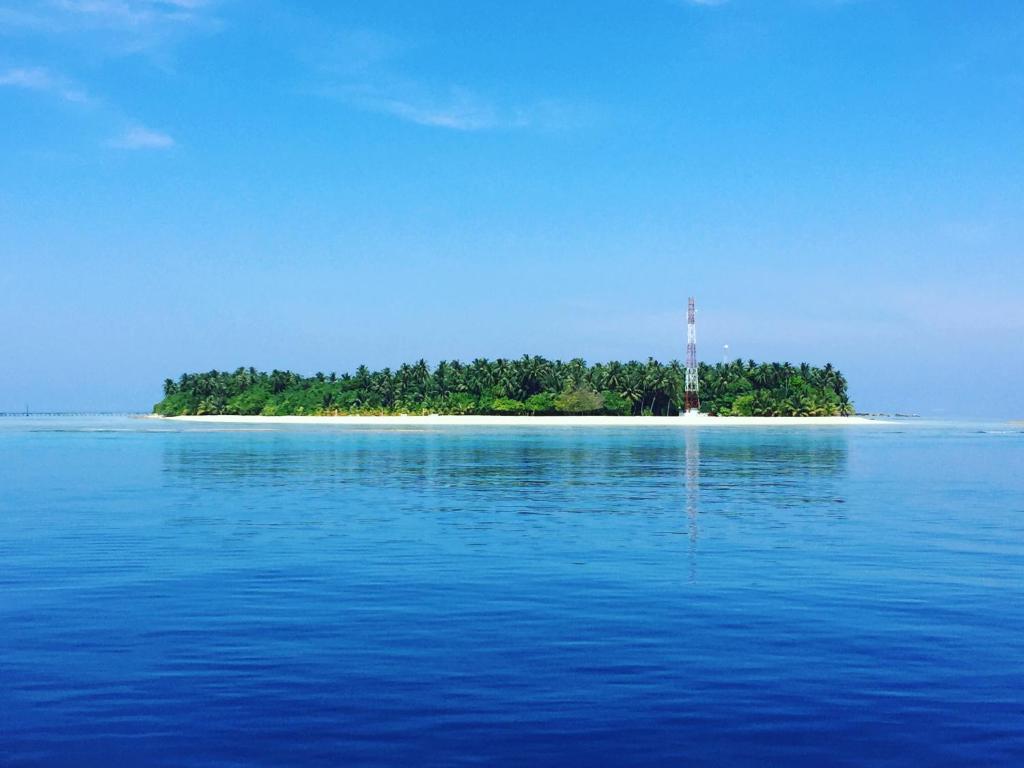 an island in the middle of a large body of water at Noomuraka Inn in Omadhoo