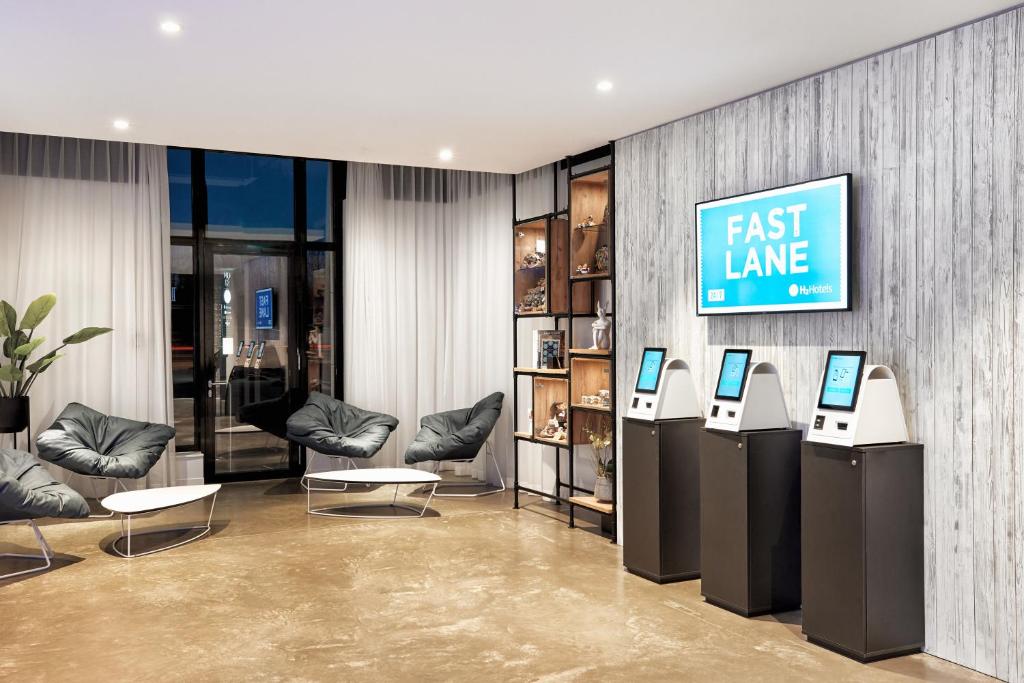 a fast lane store with two cell phones on display at H2 Hotel München Olympiapark in Munich