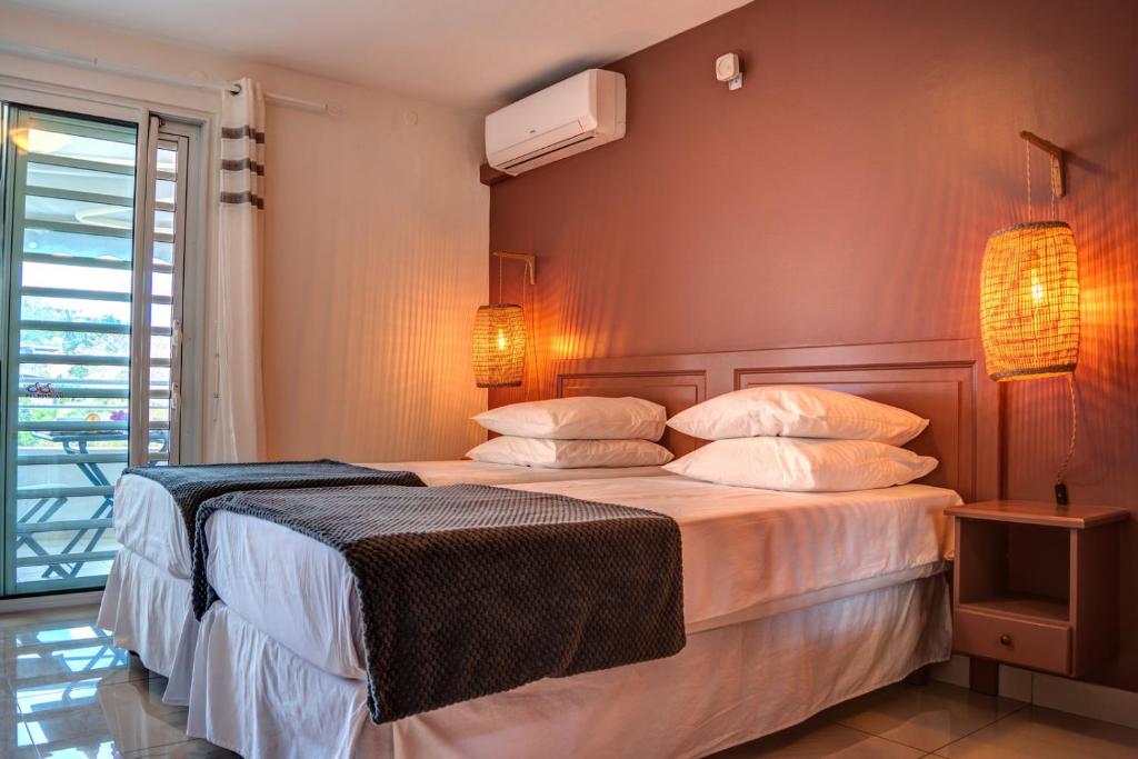 Postel nebo postele na pokoji v ubytování Hotel Pelican
