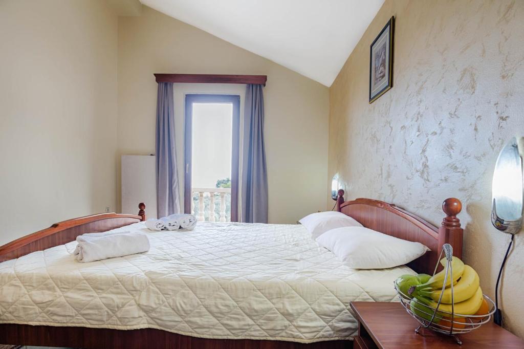 Postel nebo postele na pokoji v ubytování Mali Miločer Bay Accommodation
