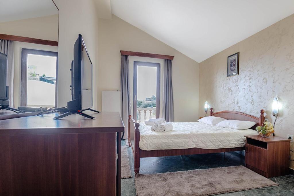 Postel nebo postele na pokoji v ubytování Mali Miločer Bay Accommodation