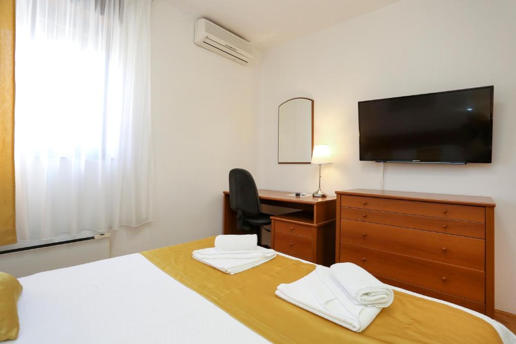 Postel nebo postele na pokoji v ubytování Luxury Apartment ELA