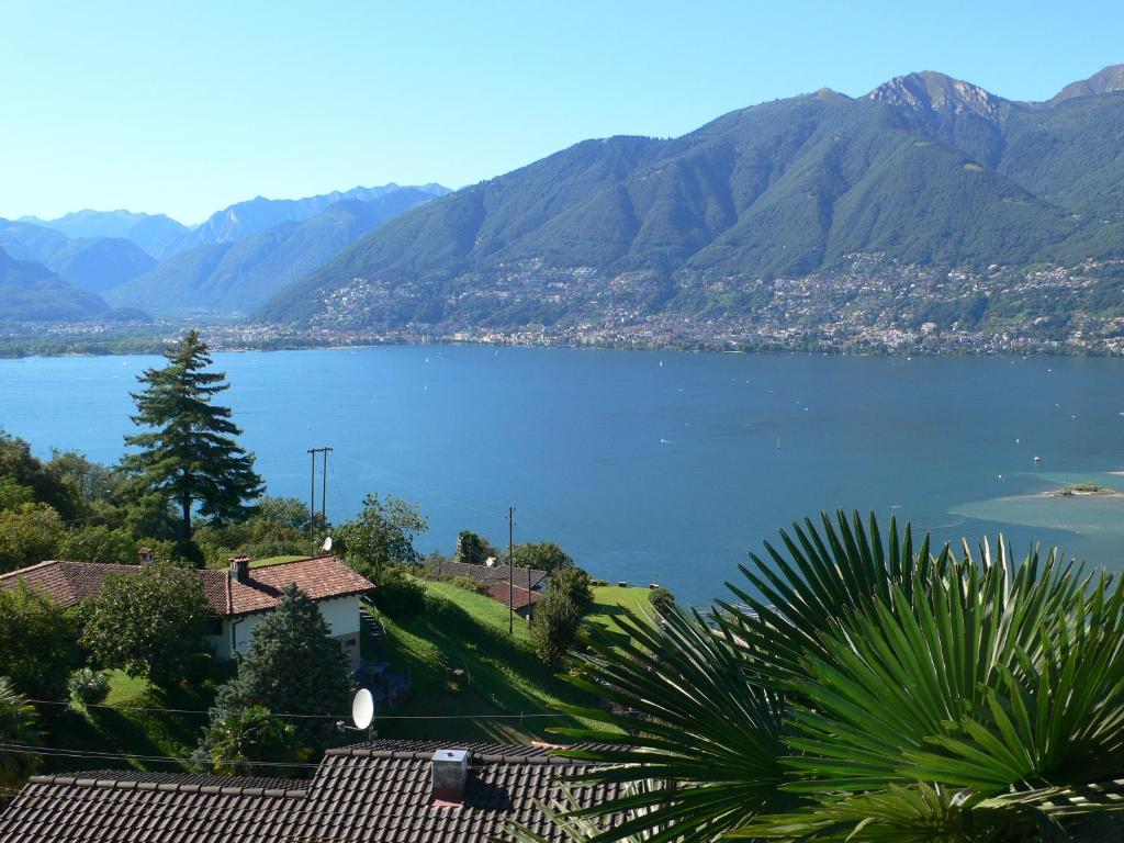 a view of a large body of water with mountains at Casa Petra 1 1/2 Zi, Orgnana 83 in Magadino