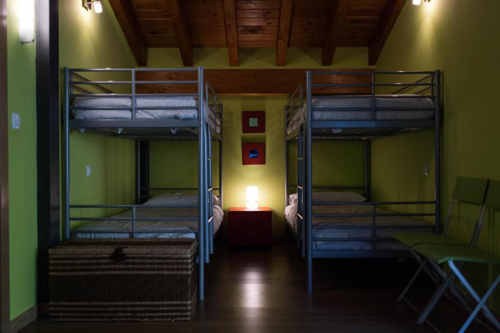A bed or beds in a room at La Riega del Peral