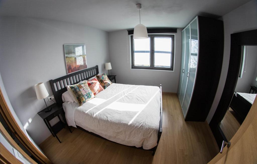 A bed or beds in a room at La Riega del Peral