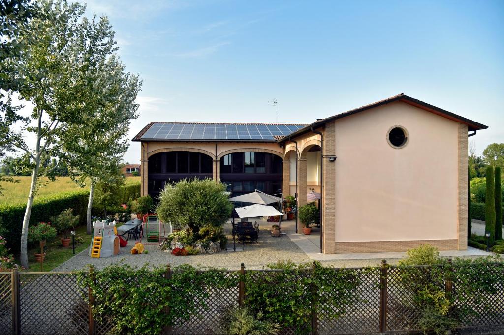 a building with a solar panel on top of it at Agriturismo Argaland in Parma