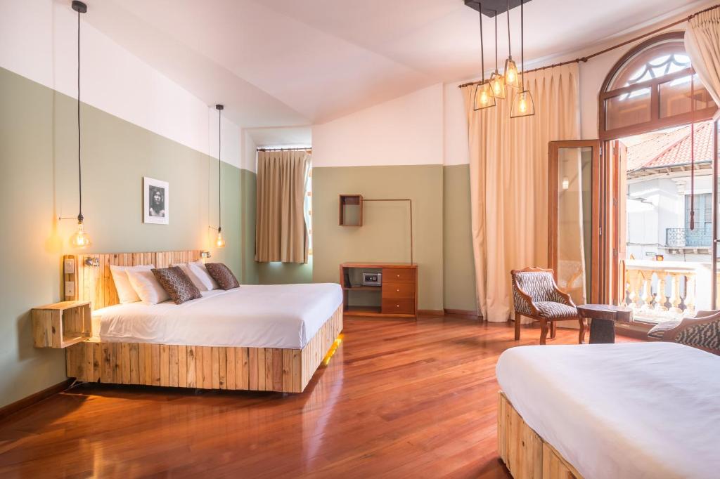 Postel nebo postele na pokoji v ubytování Viajero Quito Hostel
