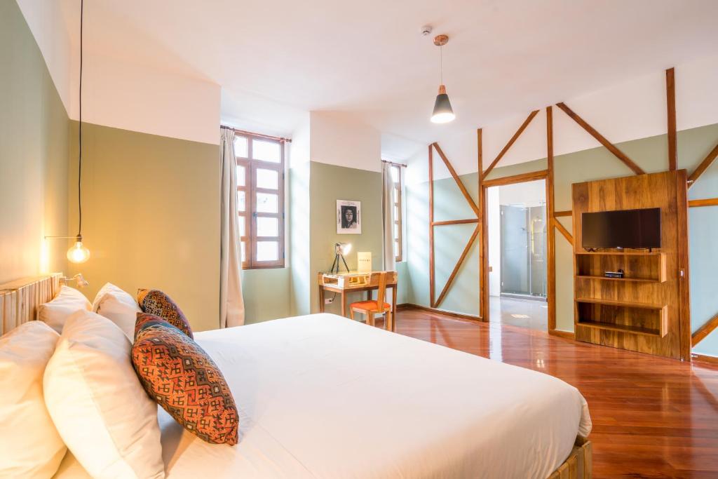 Postel nebo postele na pokoji v ubytování Viajero Quito Hostel