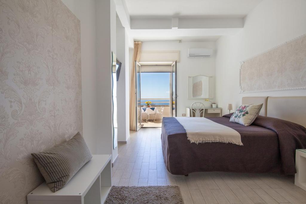 Postel nebo postele na pokoji v ubytování Mini Hotel - Angolo Di Paradiso -
