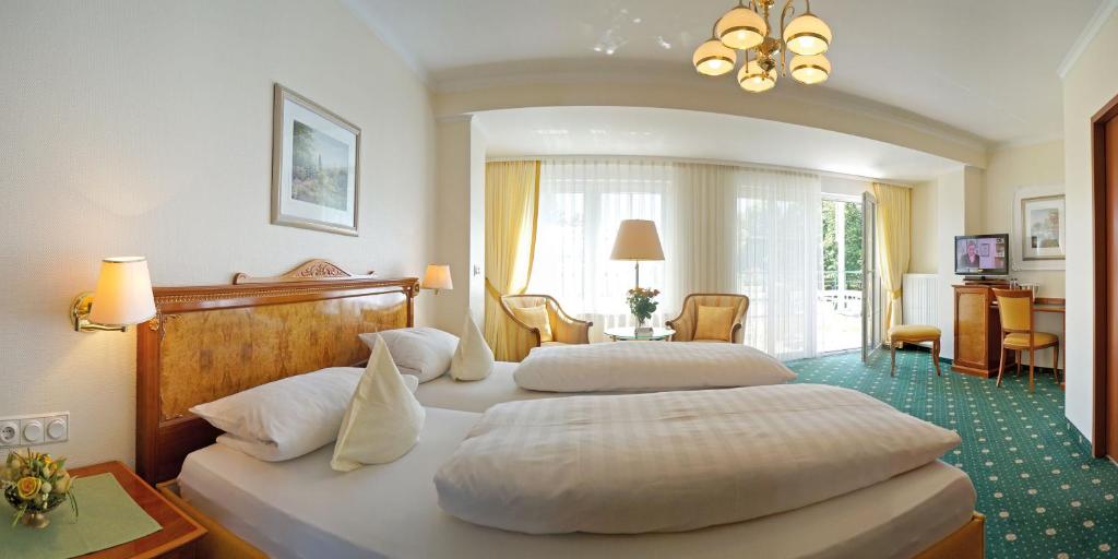 Postel nebo postele na pokoji v ubytování Hotel Sacher-Stoiber