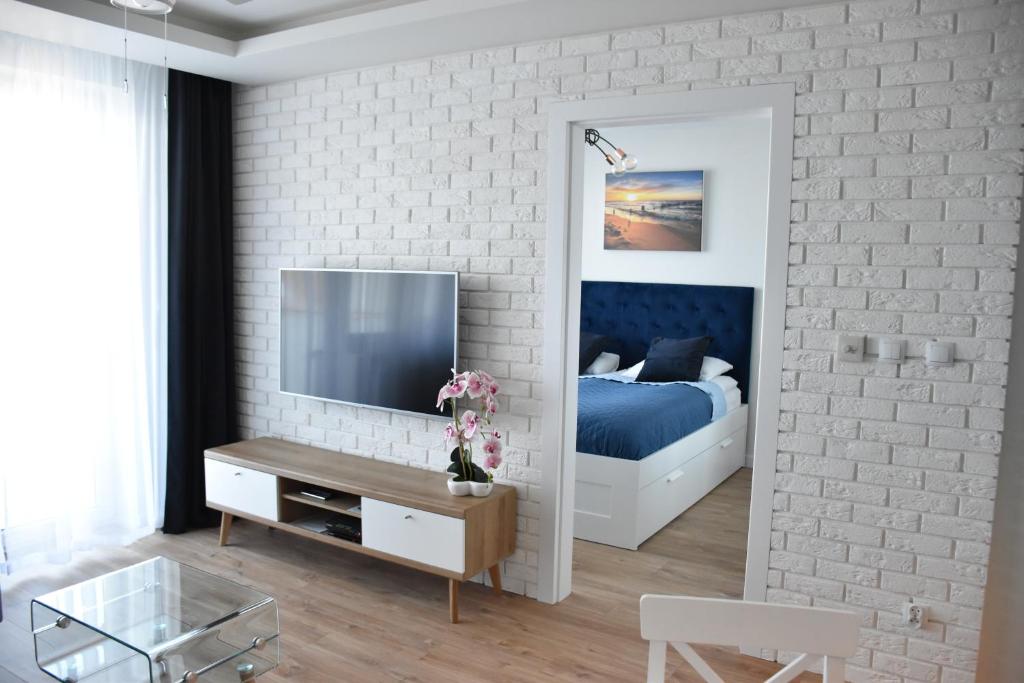 TV a/nebo společenská místnost v ubytování Apartamenty Balticum - Bliżej Morza z garażem
