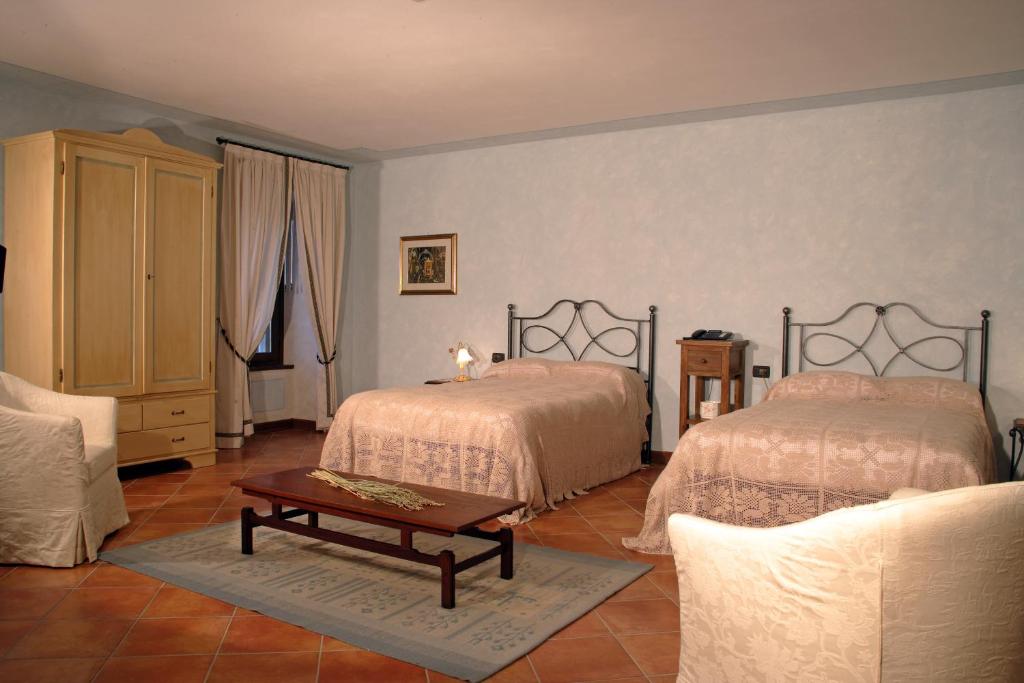 Postel nebo postele na pokoji v ubytování Agriturismo Macesina