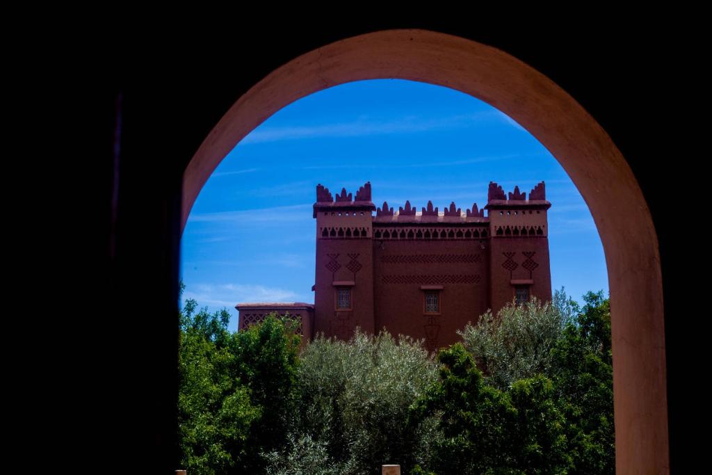 a view of a building through an arch at Kasbah Ait Kassi in Boumalne
