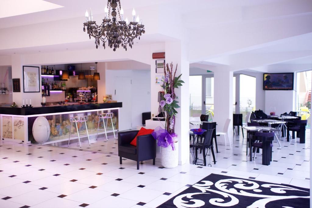 TV a/nebo společenská místnost v ubytování Hotel Leonardo
