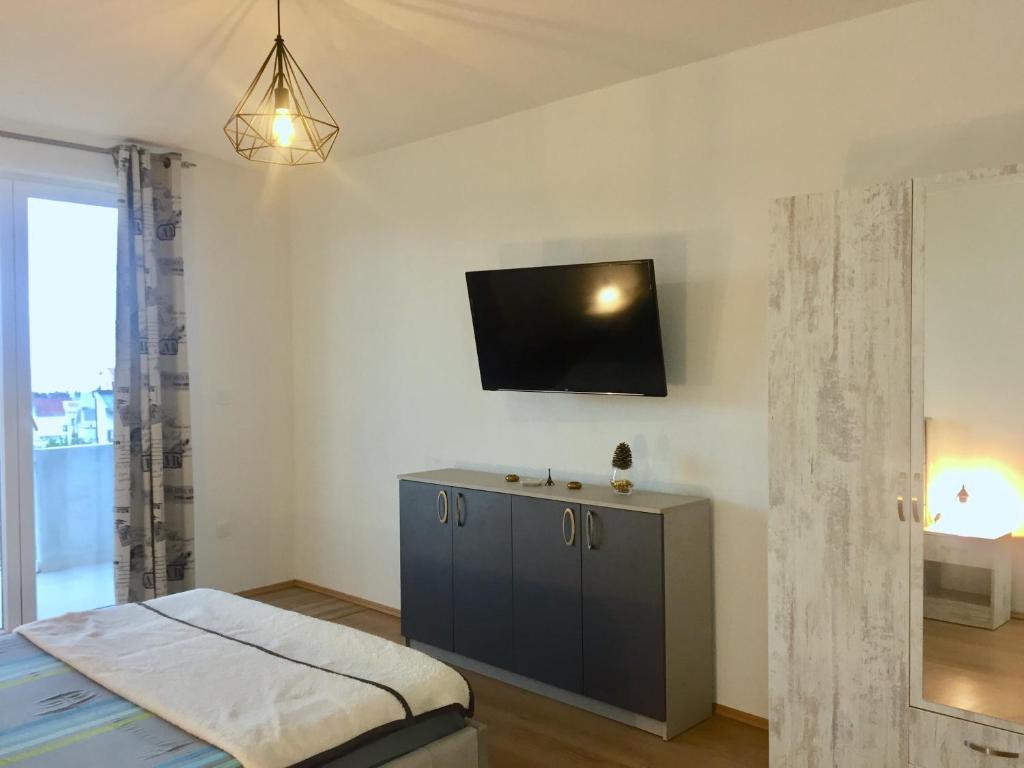 Телевизор и/или развлекательный центр в Aparthotel Monterria