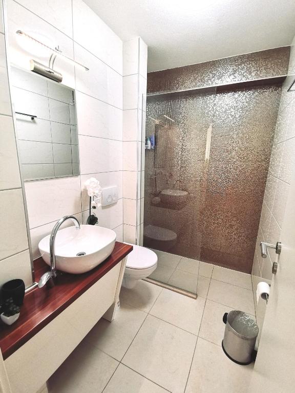 Koupelna v ubytování Apartments Ante