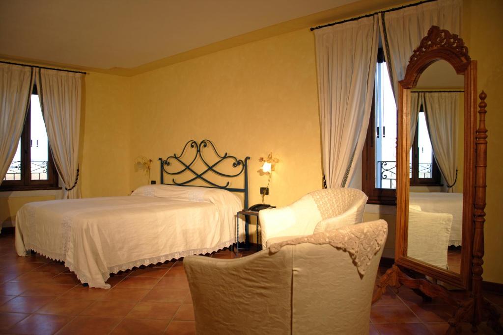 Postel nebo postele na pokoji v ubytování Agriturismo Macesina