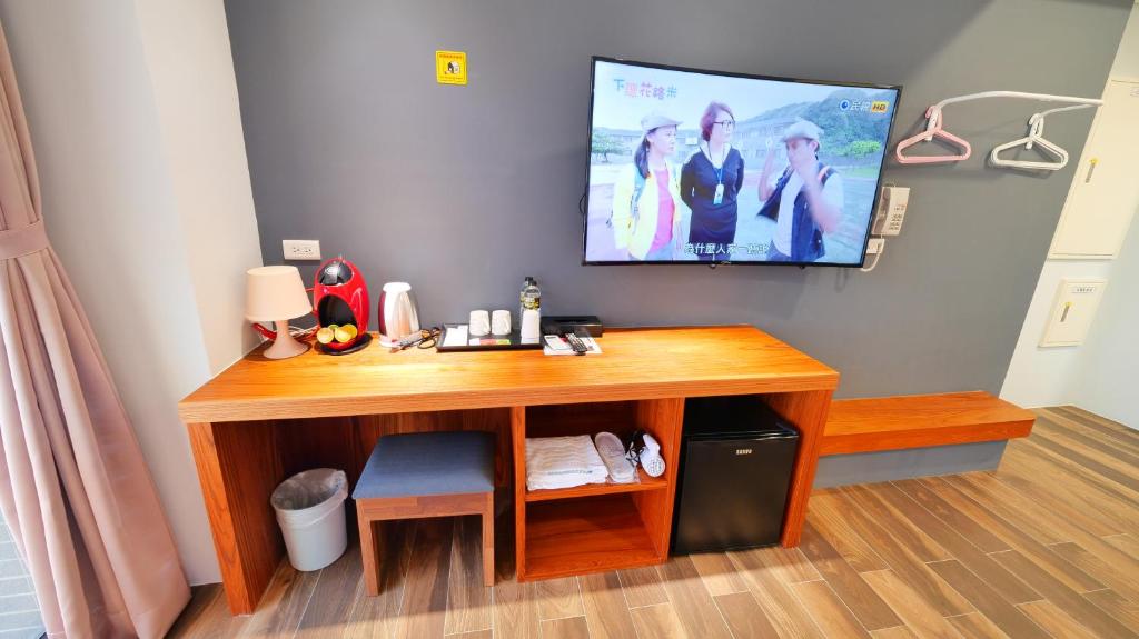 TV a/nebo společenská místnost v ubytování Apause Hotel