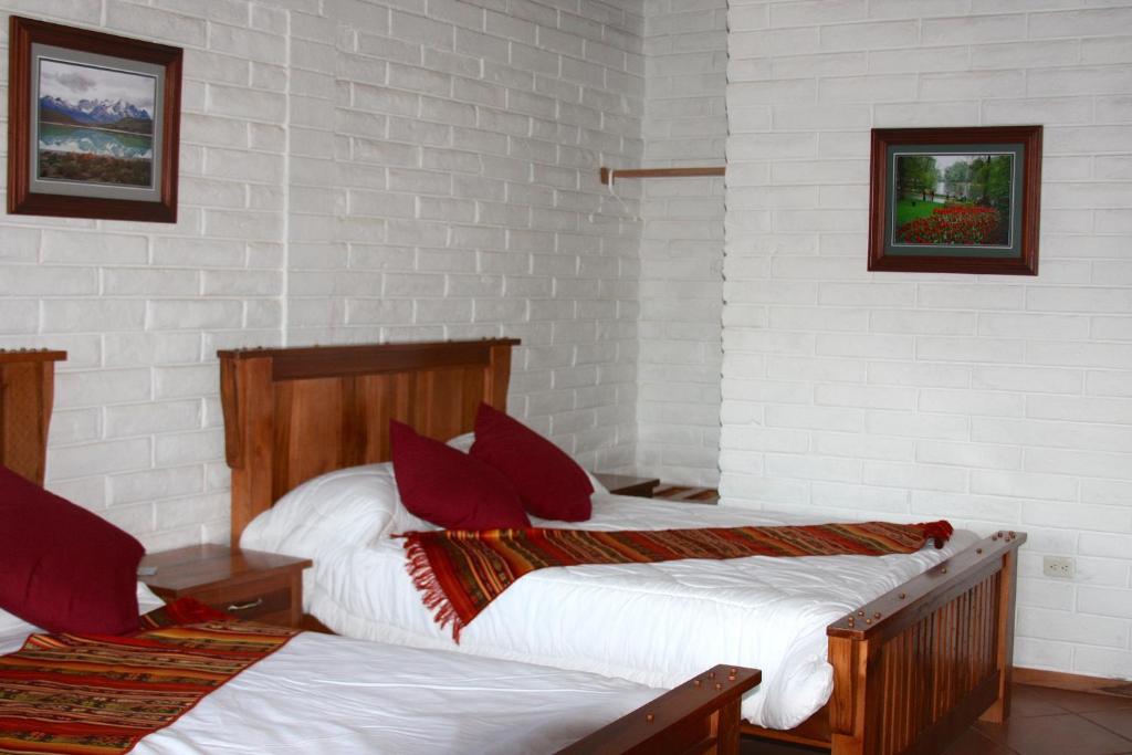 Postel nebo postele na pokoji v ubytování Hosteria Cananvalle