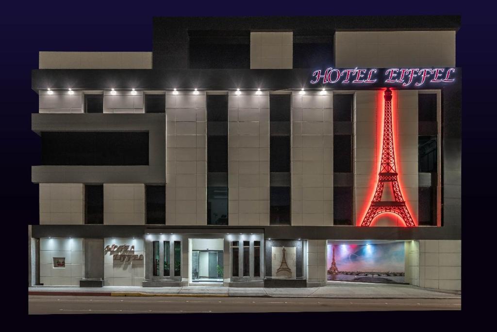 a building with the eiffel tower at night at HOTEL EIFFEL in Ensenada