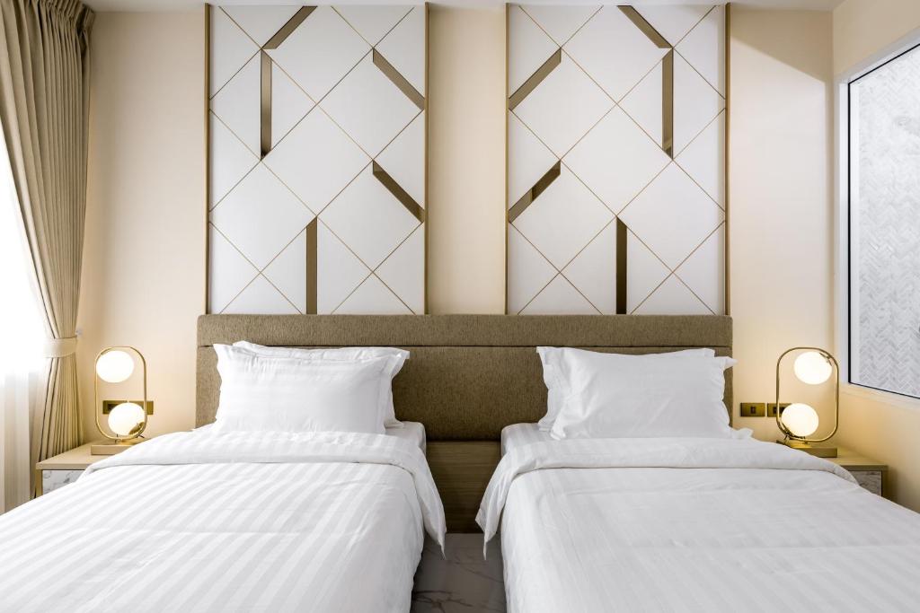 Postel nebo postele na pokoji v ubytování The 8 Hotel Udonthani