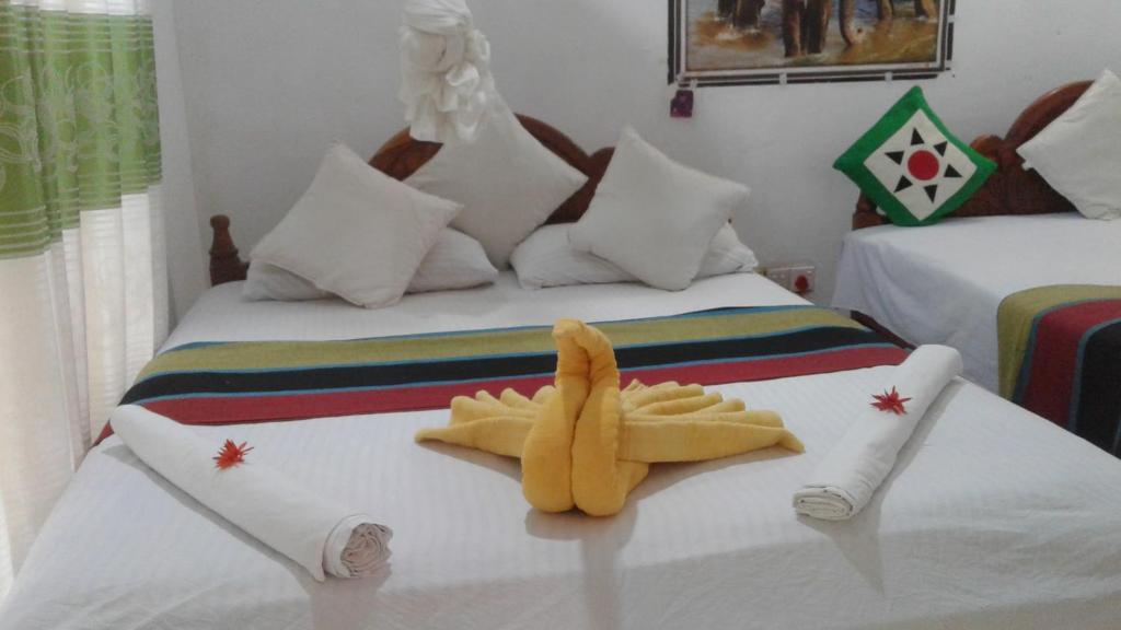 Postel nebo postele na pokoji v ubytování Kalana Homestay