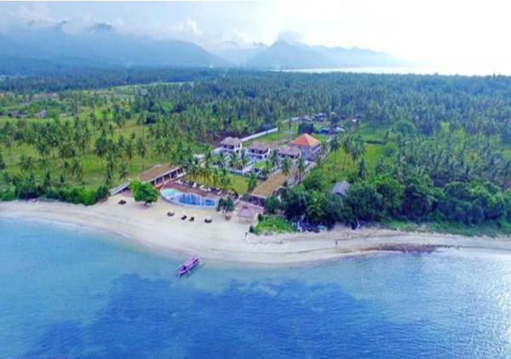 an aerial view of an island in the ocean at Anema Wellness Villa & Spa Gili Lombok - Diving Center PADI in Tanjung