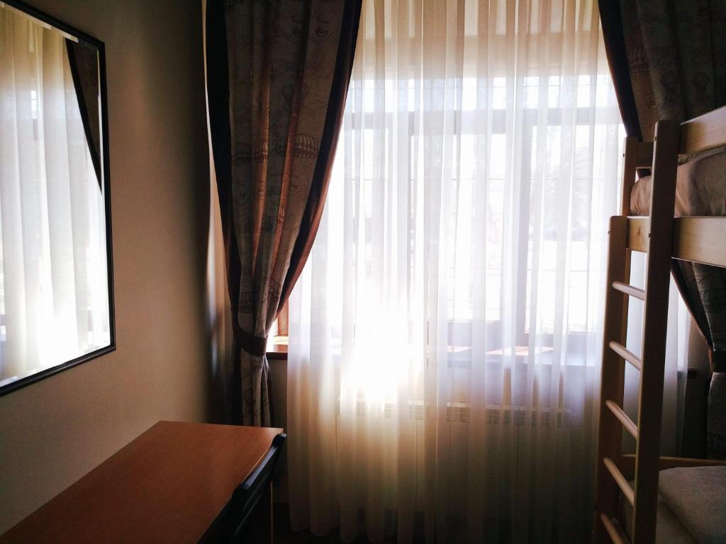 Postel nebo postele na pokoji v ubytování Belokorichi