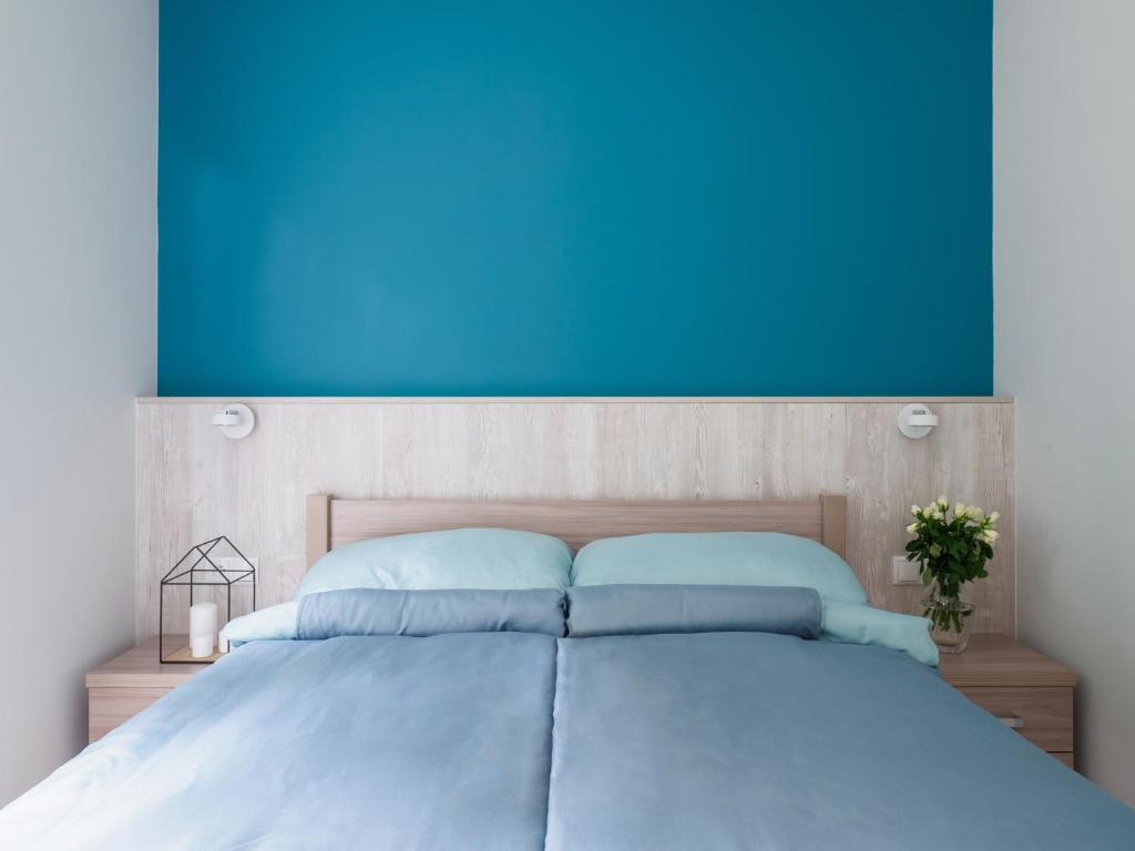 Postel nebo postele na pokoji v ubytování Parkova Apartamenty