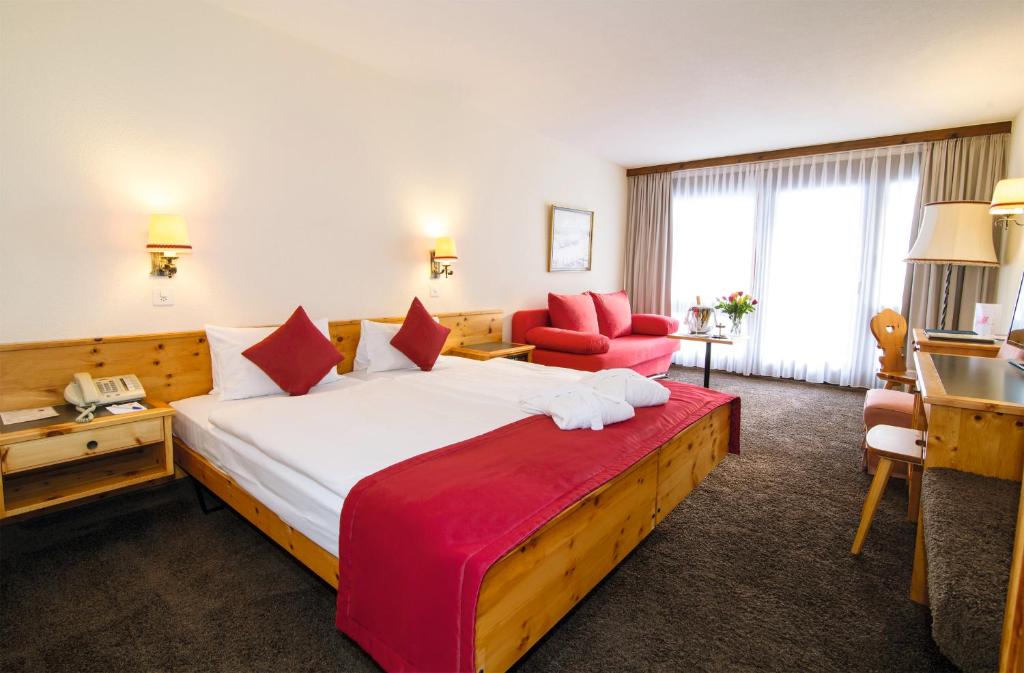 Postel nebo postele na pokoji v ubytování Central Sporthotel Davos