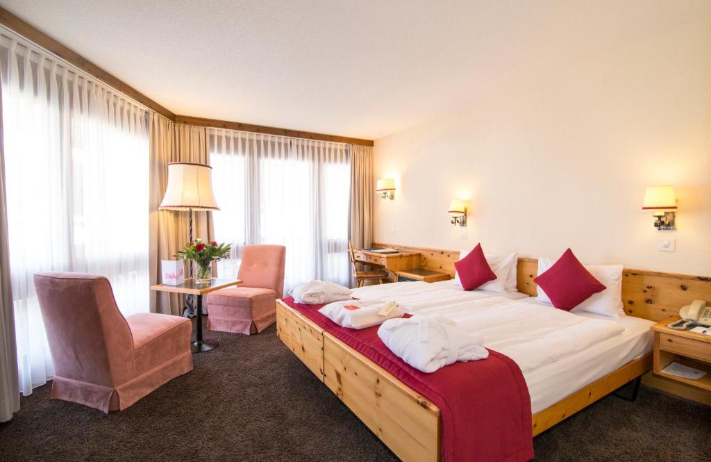 Postel nebo postele na pokoji v ubytování Central Sporthotel Davos
