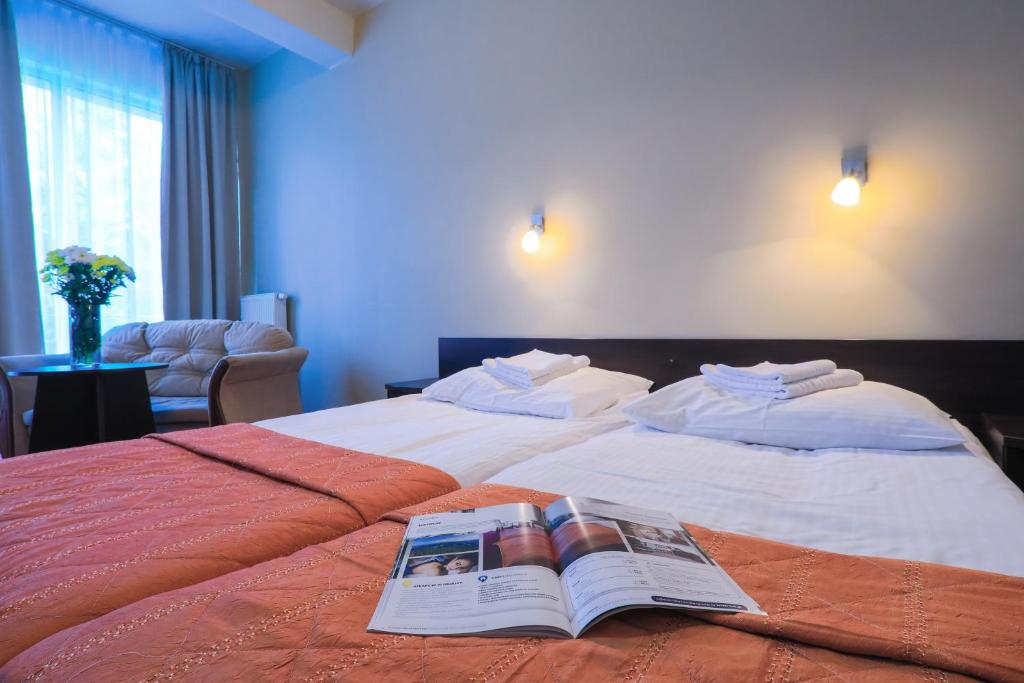 Postel nebo postele na pokoji v ubytování Hotel *** NAT Ustroń
