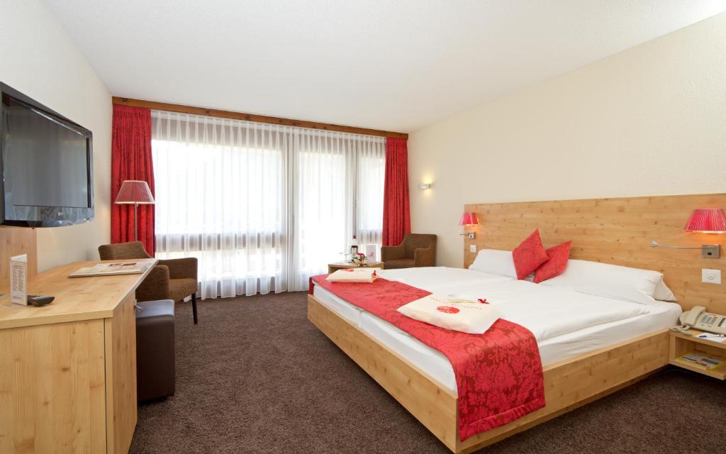 Postel nebo postele na pokoji v ubytování Central Sporthotel Davos