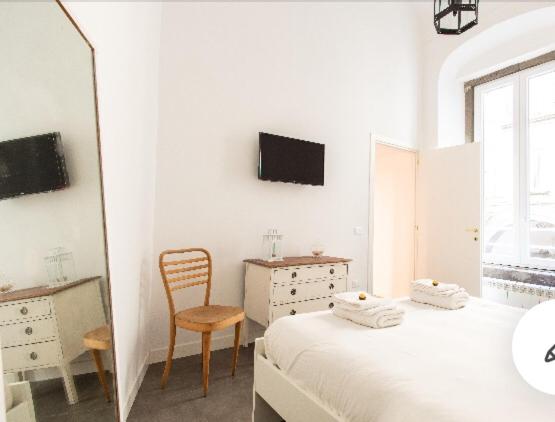 Posteľ alebo postele v izbe v ubytovaní CosyHomeSuite Napoli