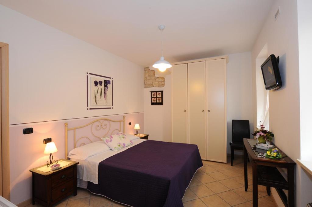 A bed or beds in a room at Agriturismo Terra E Sole