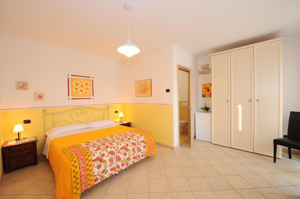A bed or beds in a room at Agriturismo Terra E Sole