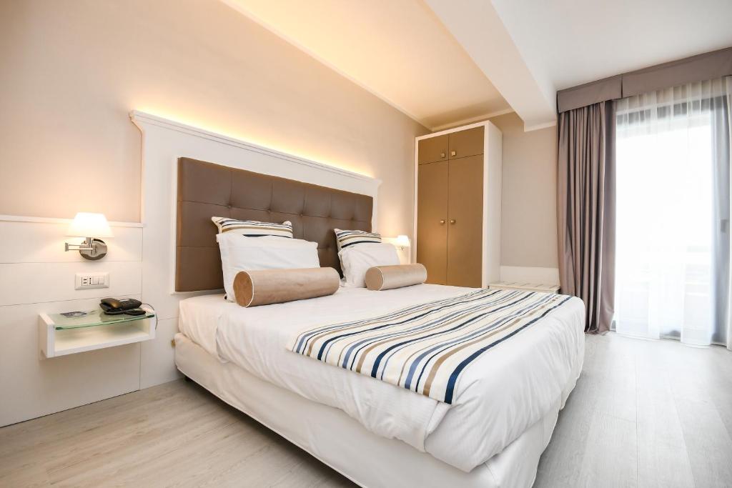 Postel nebo postele na pokoji v ubytování Hotel Oliveto