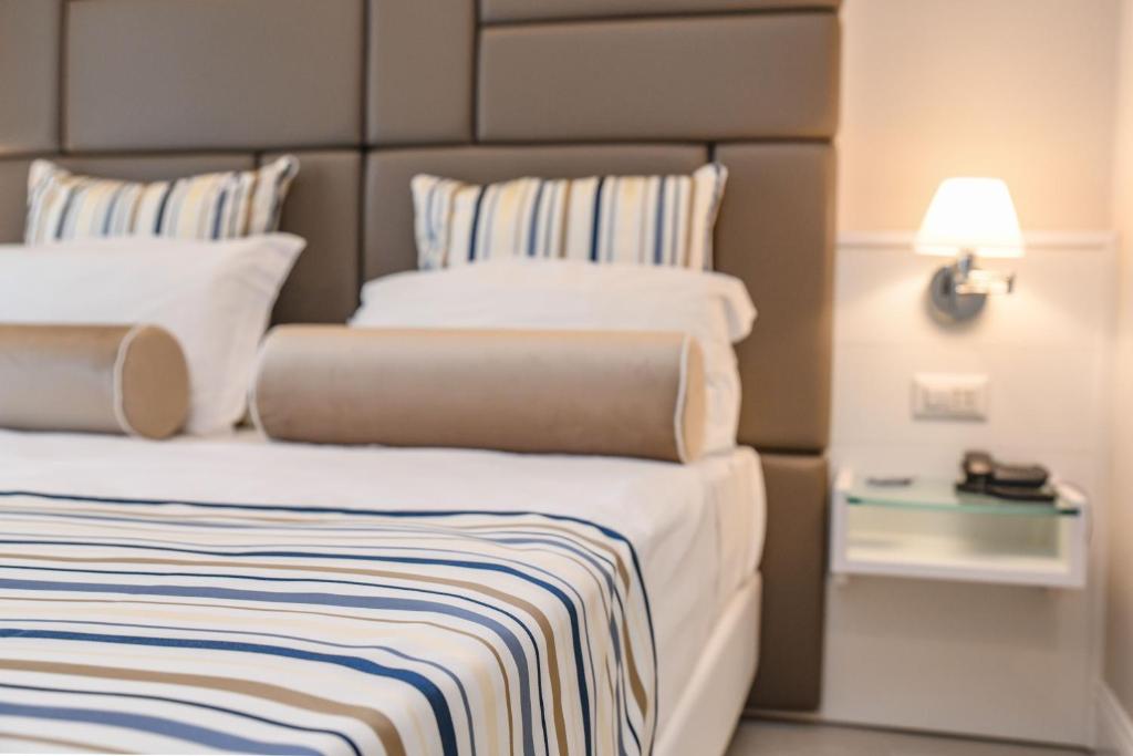 Postel nebo postele na pokoji v ubytování Hotel Oliveto