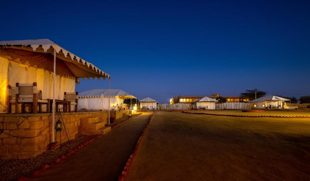 a row of white buildings at night at Hotel Rawalkot Jaisalmer in Jaisalmer