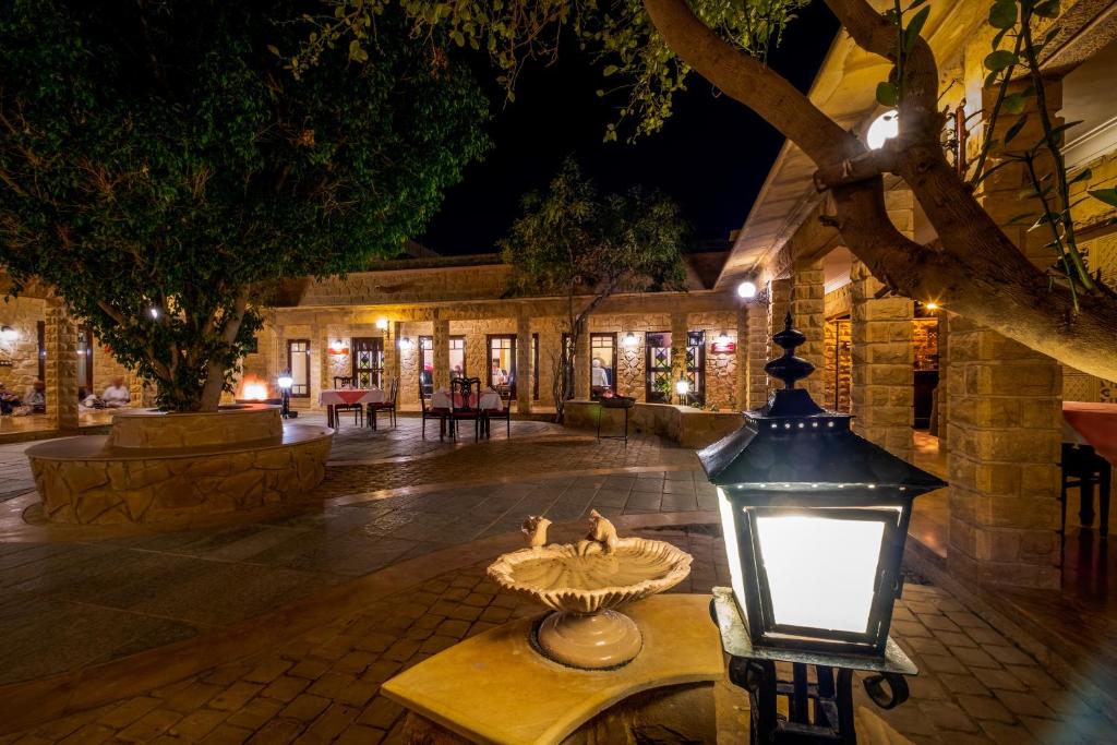 a street light in a courtyard at night at Hotel Rawalkot Jaisalmer in Jaisalmer