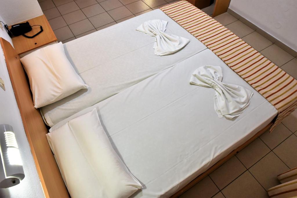 Postel nebo postele na pokoji v ubytování Ideal Hotel
