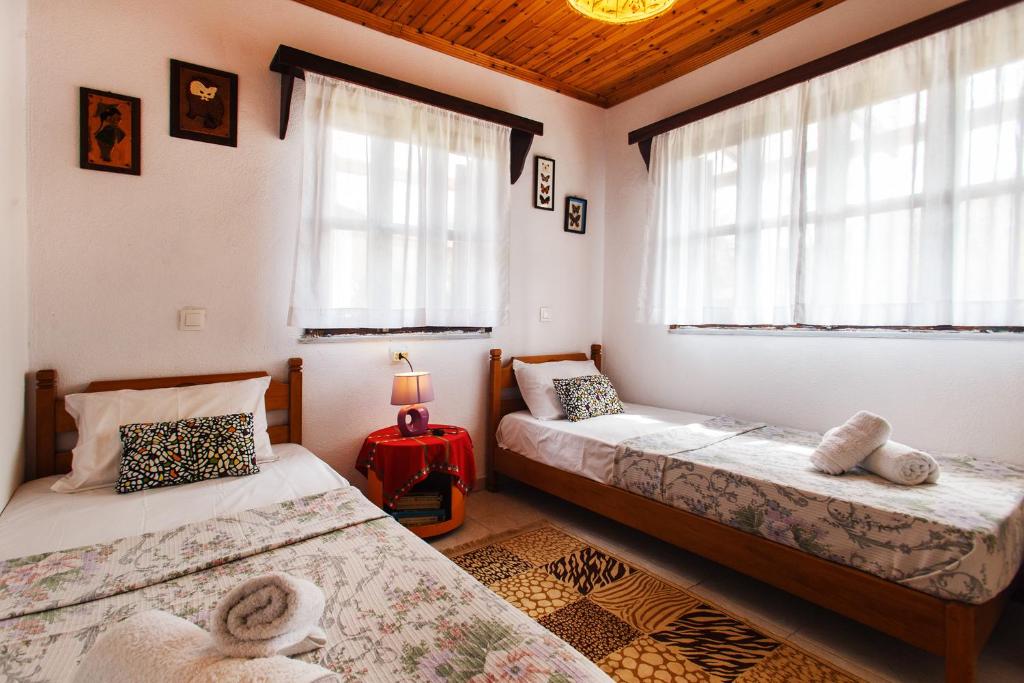 Postel nebo postele na pokoji v ubytování Villa Achilleas
